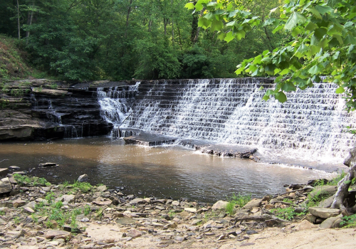 Waterfall Cascading down Steep Steps in a Park